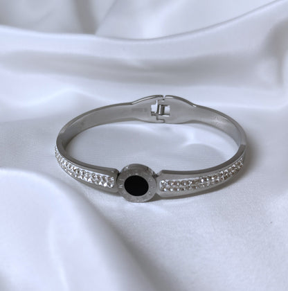 Bracciale bangle in acciaio inox color oro/argento con strass effetto orologio con pietra centrale color nero