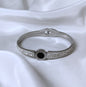 Bracciale bangle in acciaio inox color oro/argento con strass effetto orologio con pietra centrale color nero
