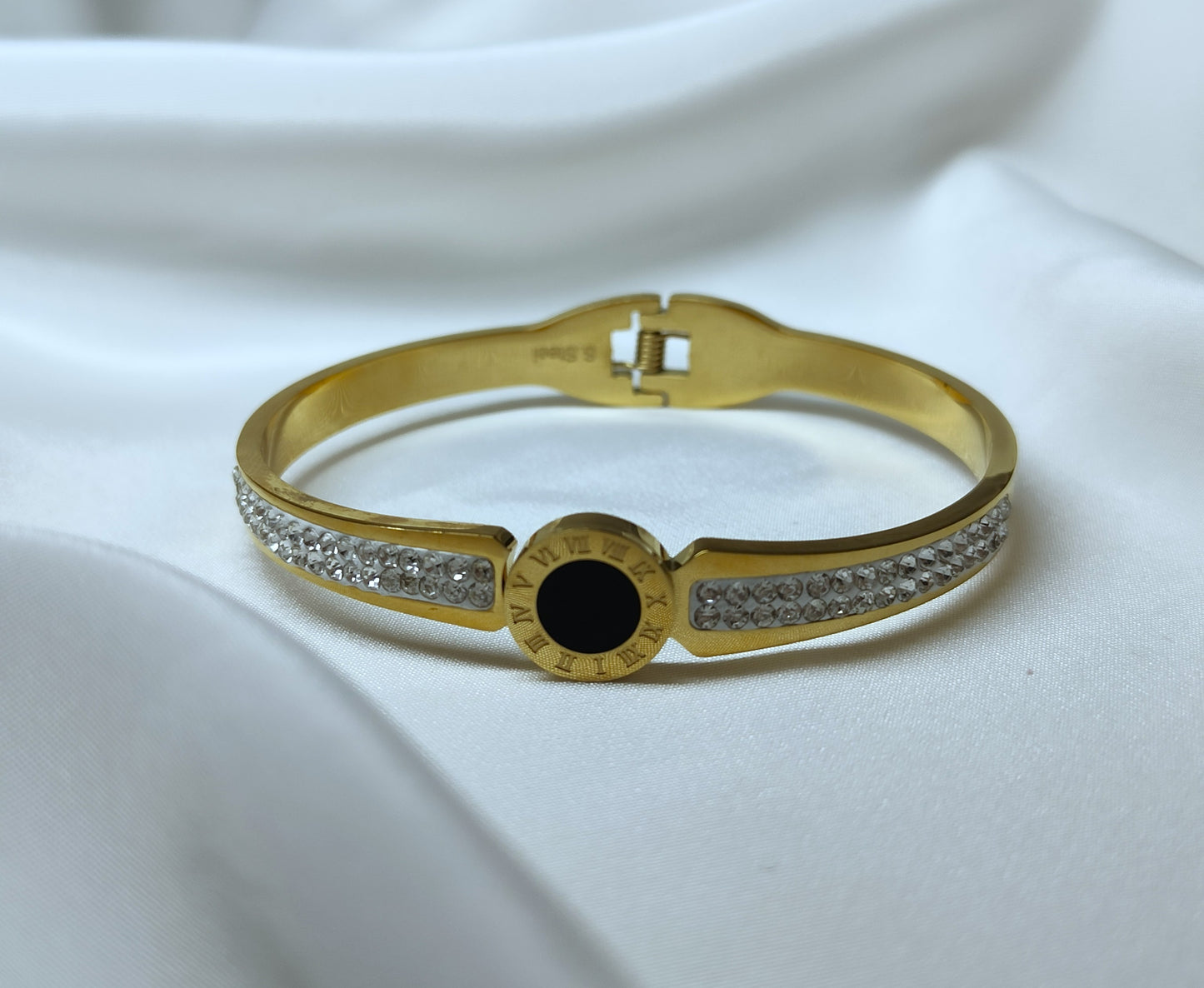 Bracciale bangle in acciaio inox color oro/argento con strass effetto orologio con pietra centrale color nero