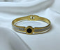 Bracciale bangle in acciaio inox color oro/argento con strass effetto orologio con pietra centrale color nero
