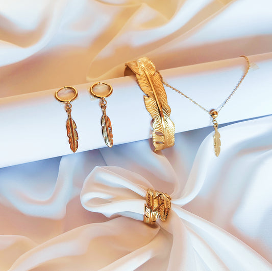 Set gioielli abbinati a forma di piuma