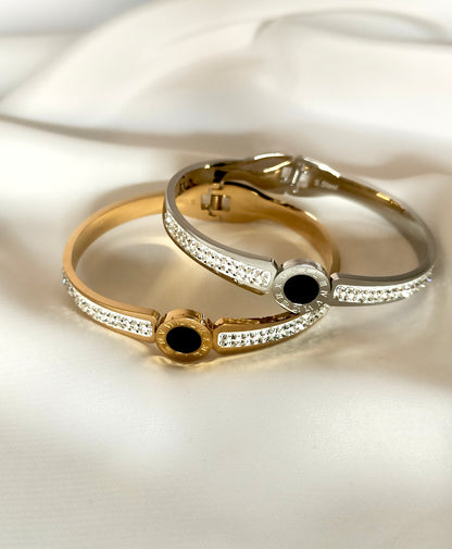 Bracciale bangle in acciaio inox color oro/argento con strass effetto orologio con pietra centrale color nero