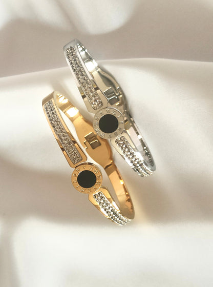 Bracciale bangle in acciaio inox color oro/argento con strass effetto orologio con pietra centrale color nero
