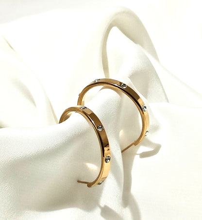 Orecchini design Cartier in acciaio inossidabile