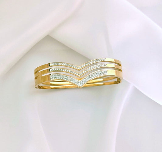 Bracciale "Trilogy chevron "in  acciaio inossidabile  color oro e pavé.